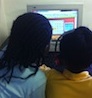 2 little girls on computer c.jpg